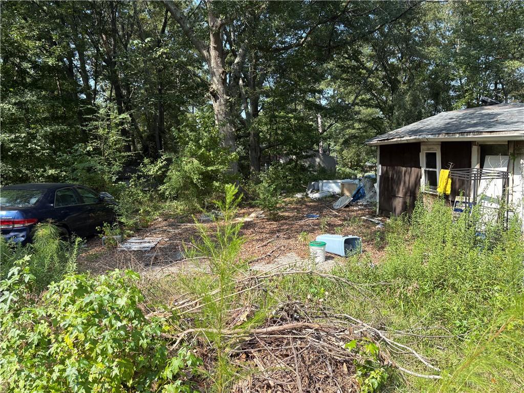 6355 Kimberly Mill Road South Fulton, GA 30349 - Photo 22 of 68 a backyard of a house with yard and trampoline