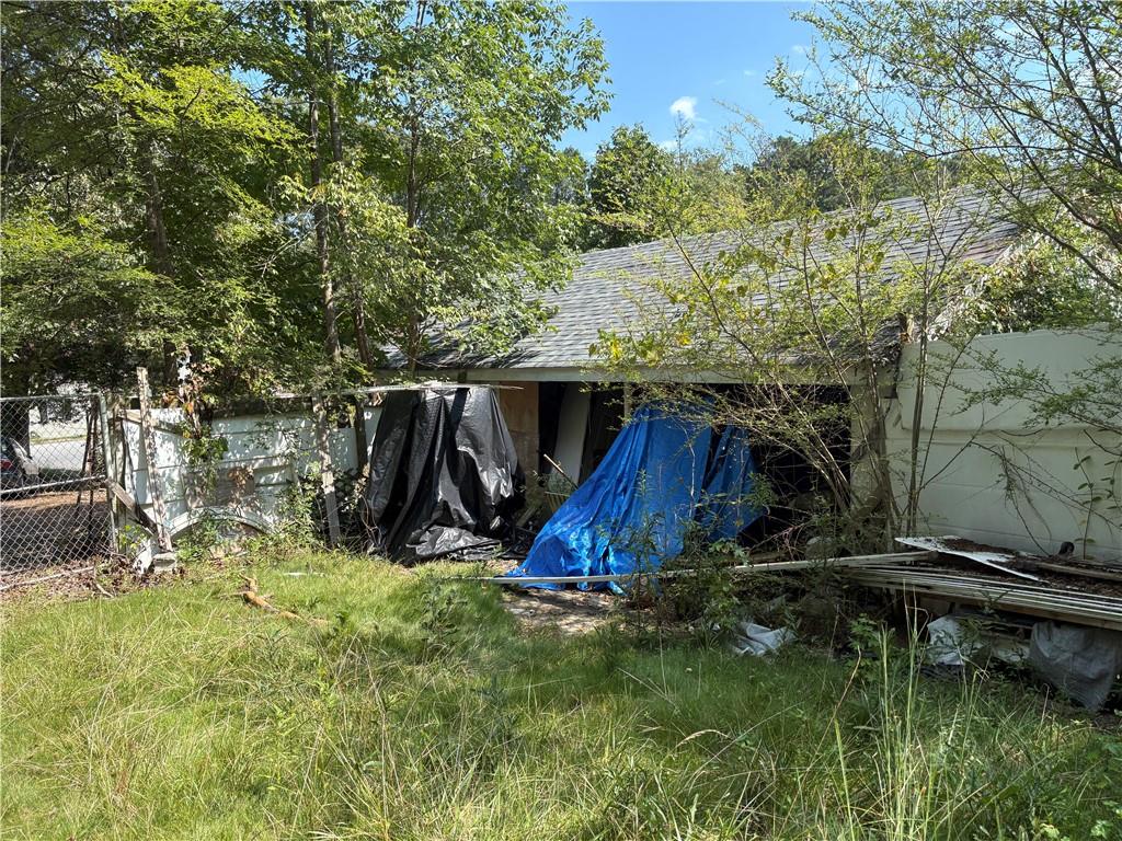 6355 Kimberly Mill Road South Fulton, GA 30349 - Photo 25 of 68 a view of backyard with wooden fence and a large tree