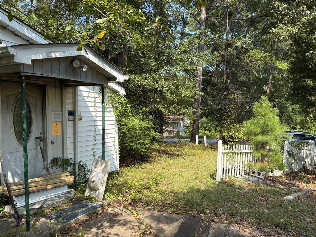 6355 Kimberly Mill Road South Fulton, GA 30349 - Photo 32 of 68 a front view of a house with a yard
