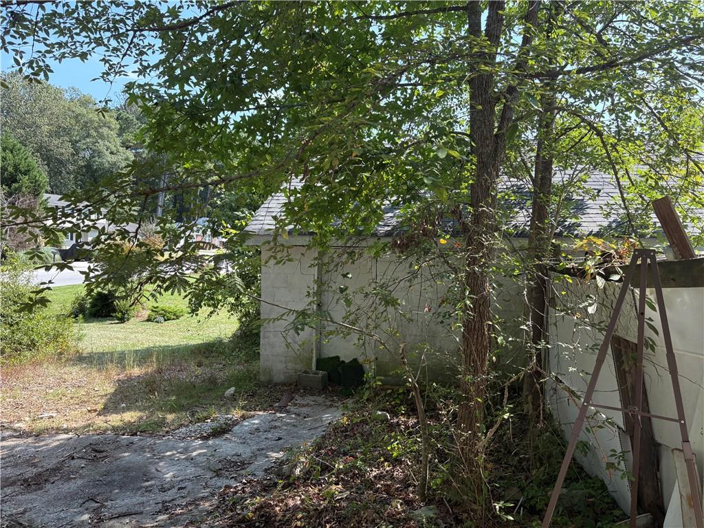 6355 Kimberly Mill Road South Fulton, GA 30349 - Photo 35 of 68 a view of a yard with plants and large trees