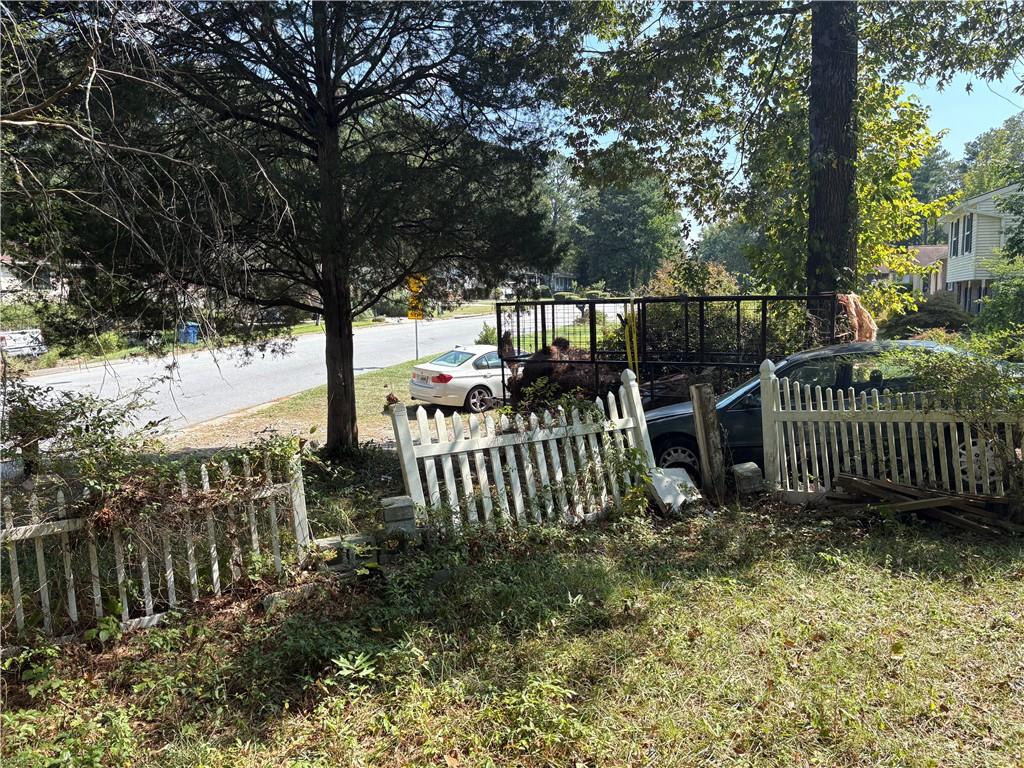 6355 Kimberly Mill Road South Fulton, GA 30349 - Photo 56 of 68 a view of a yard with swing plants and wooden fence