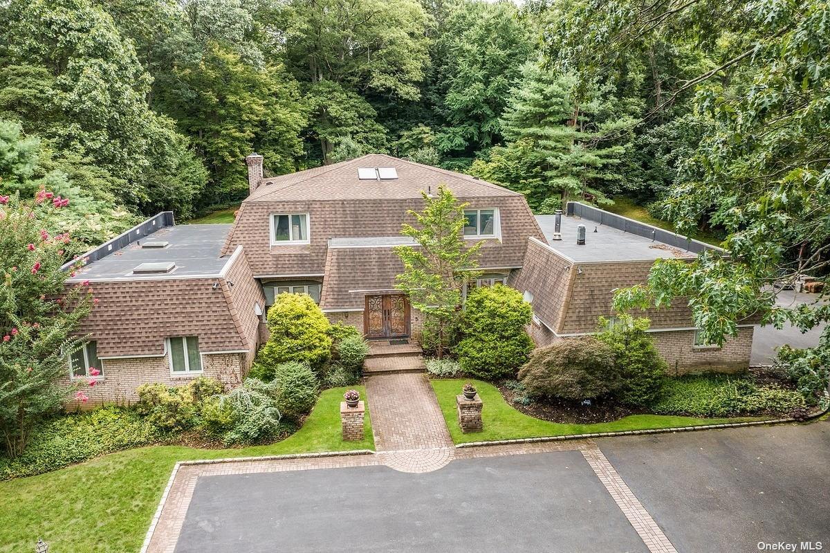 5 Heather Hill Road Glen Head, NY 11545 - Photo 1 of 1 a aerial view of a house next to a yard and plants