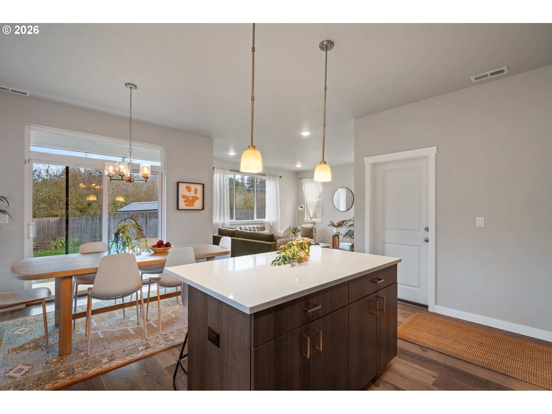 5706 Southeast 134th Place Portland, OR 97236 - Photo 14 of 39 a kitchen with a sink a counter top space and living room view
