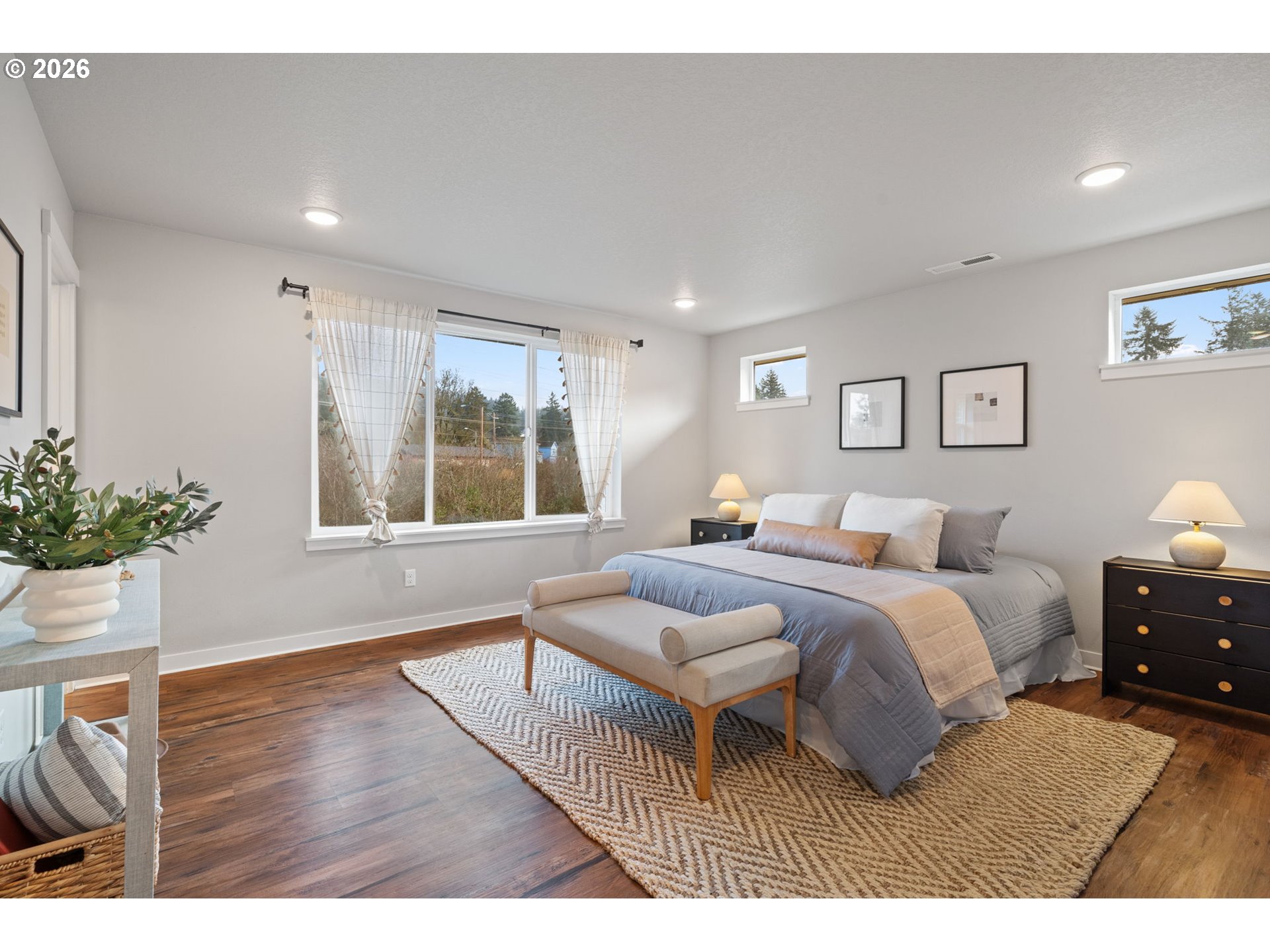 5706 Southeast 134th Place Portland, OR 97236 - Photo 20 of 39 a bedroom with a bed window and potted plant