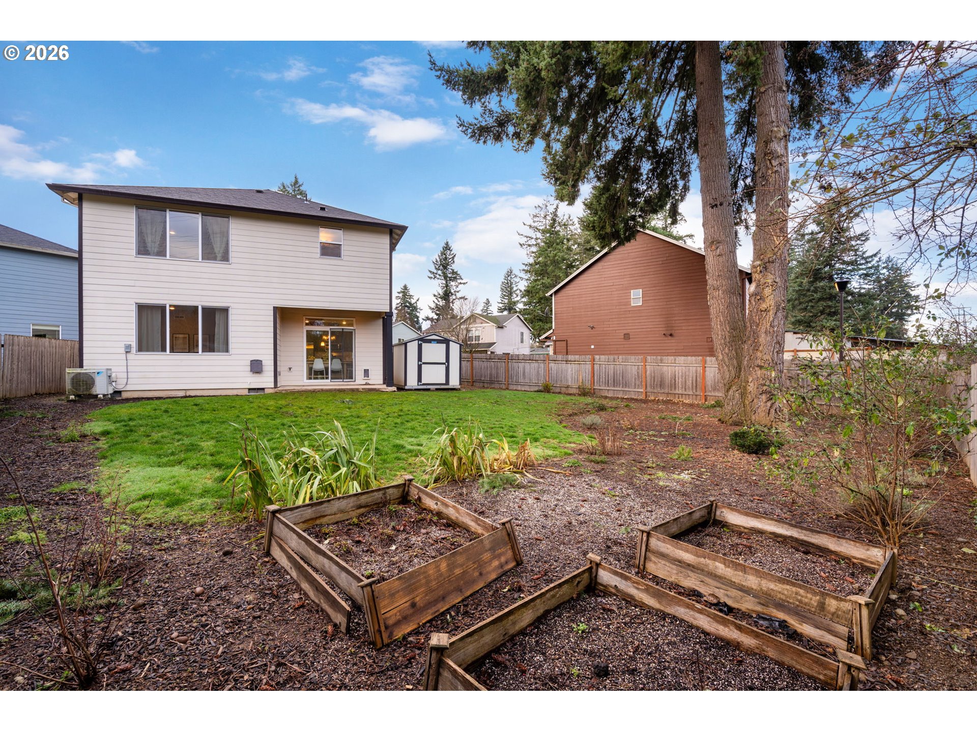 5706 Southeast 134th Place Portland, OR 97236 - Photo 38 of 39 a view of an house with backyard space and balcony