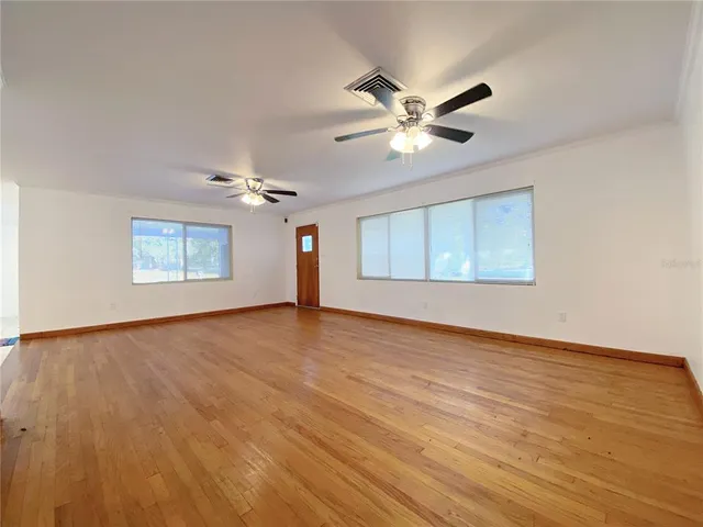a view of an empty room with a window