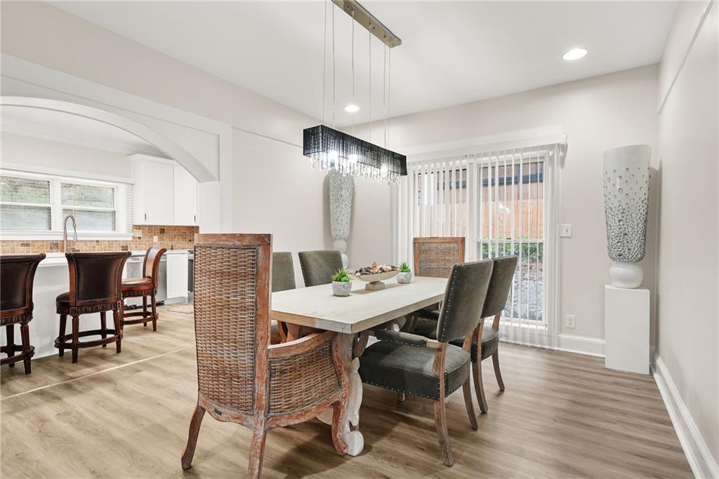 7445 Talbot Colony Northeast Atlanta, GA 30328 - Photo 11 of 41 a view of a dining room with furniture and wooden floor