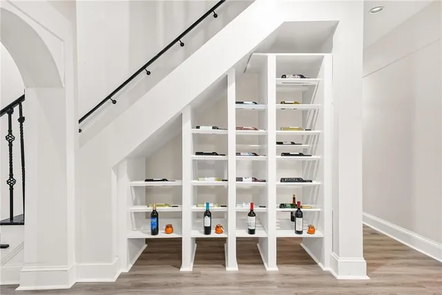 a view of dining room with wooden floor and stairs