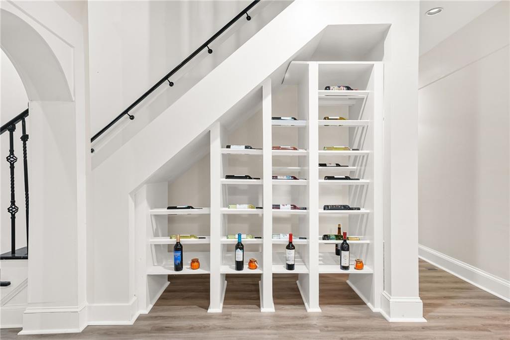 7445 Talbot Colony Northeast Atlanta, GA 30328 - Photo 12 of 41 a view of dining room with wooden floor and stairs