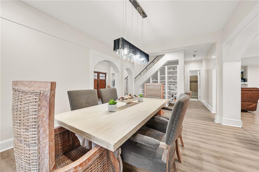 7445 Talbot Colony Northeast Atlanta, GA 30328 - Photo 13 of 41 a view of a dining room with furniture and wooden floor