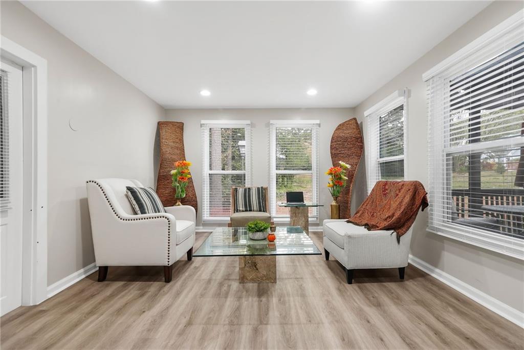 7445 Talbot Colony Northeast Atlanta, GA 30328 - Photo 19 of 41 a living room with furniture and floor to ceiling windows