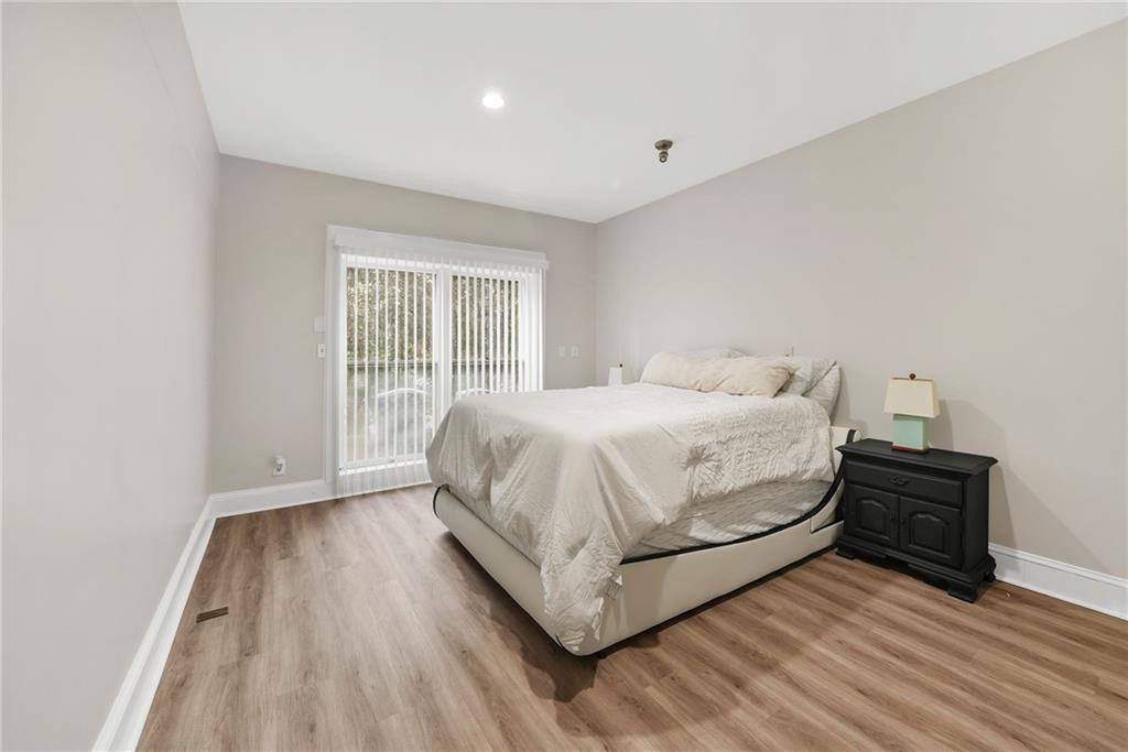7445 Talbot Colony Northeast Atlanta, GA 30328 - Photo 22 of 41 a bedroom with a bed and a window