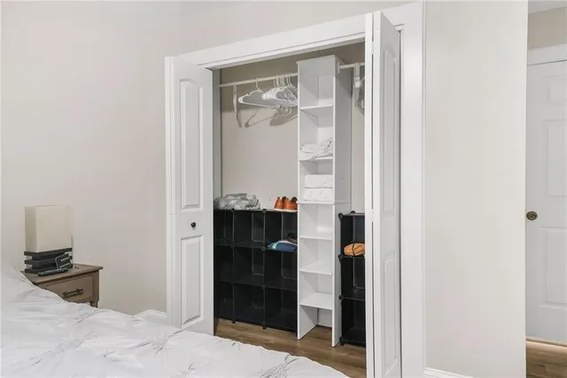 a bathroom with a glass door shower and a sink