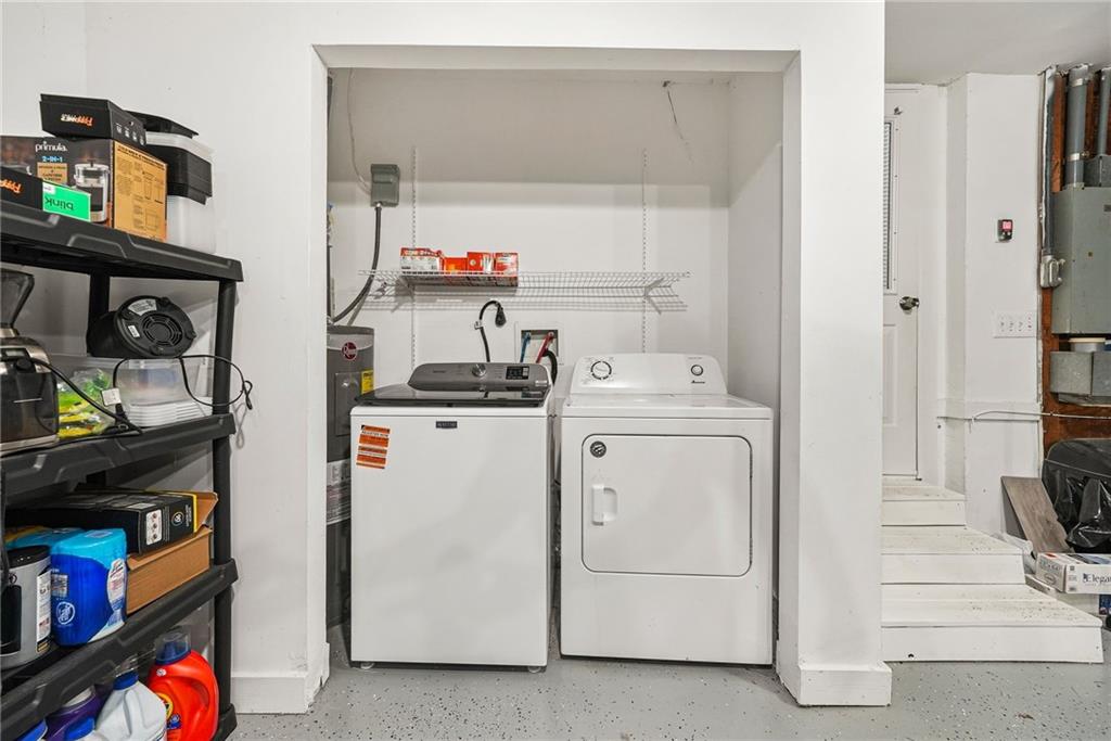 7445 Talbot Colony Northeast Atlanta, GA 30328 - Photo 36 of 41 a utility room with dryer and washer