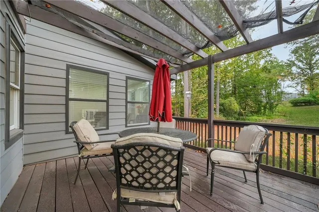 a view of a two chairs and table in the balcony