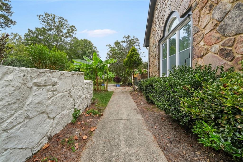 7445 Talbot Colony Northeast Atlanta, GA 30328 - Photo 40 of 41 a view of a pathway both side of house