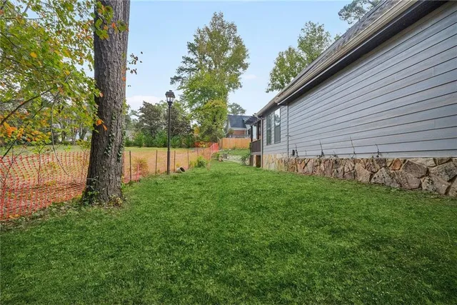 a backyard of a house with lots of green space