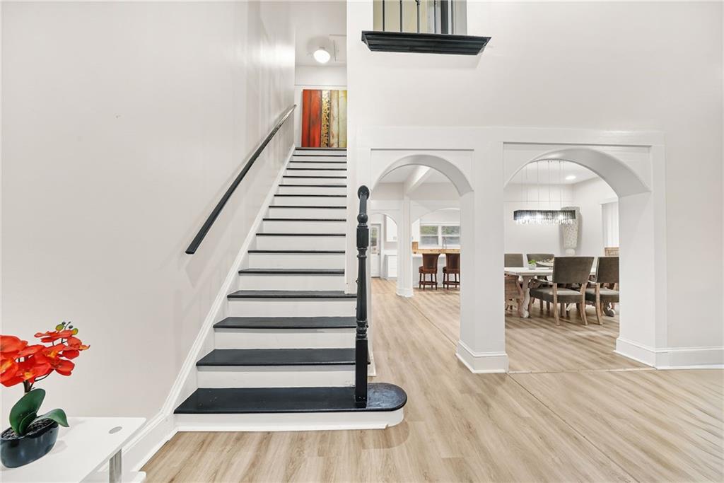 7445 Talbot Colony Northeast Atlanta, GA 30328 - Photo 6 of 41 a view of entryway and hall with wooden floor