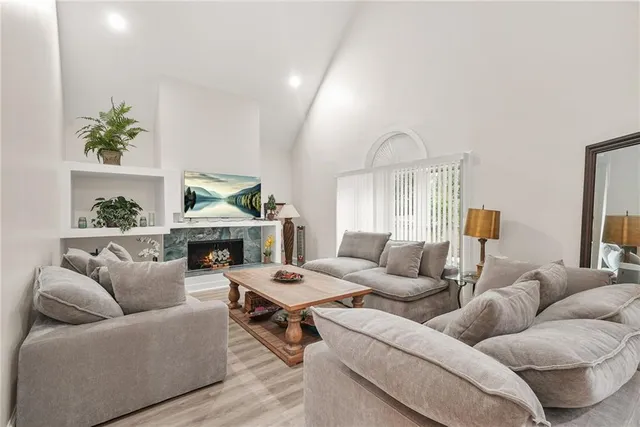 a living room with furniture and a fireplace