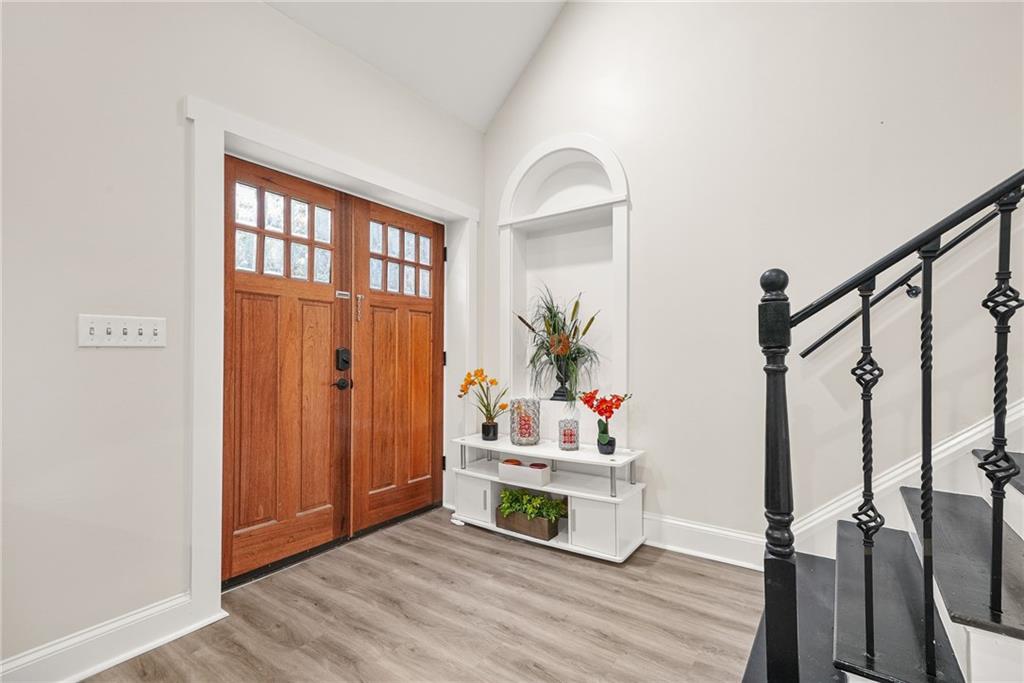 7445 Talbot Colony Northeast Atlanta, GA 30328 - Photo 10 of 41 a living room with wooden floor and furniture