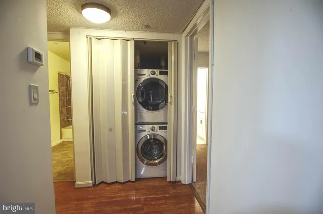a view of a hallway with washer and dryer