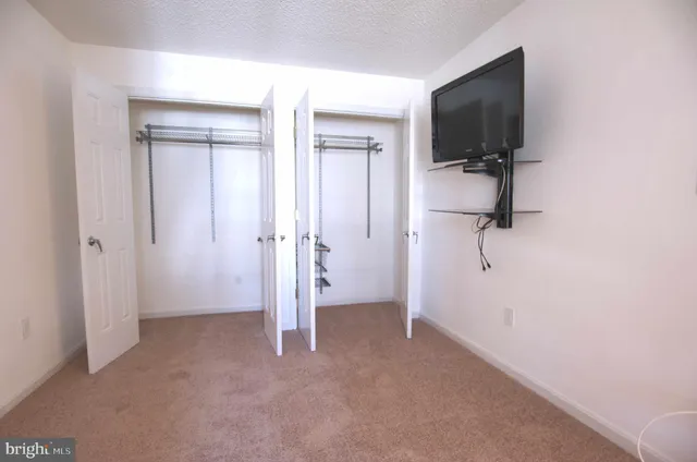 a view of a livingroom with a flat screen tv