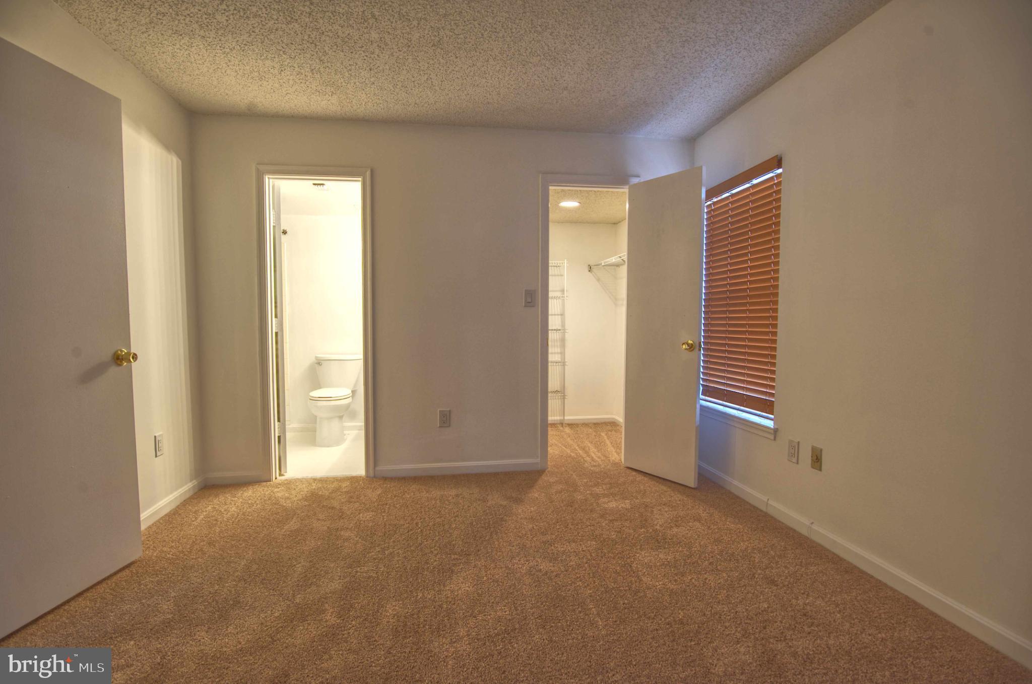 1007 Fallcrest Court, Unit 4104 Bowie, MD 20721 - Photo 10 of 22 a view of an empty room and window