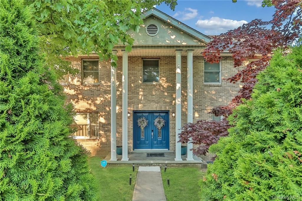 433 New Rochelle Road Bronxville, NY 10708 - Photo 1 of 41 front view of a house with a garden