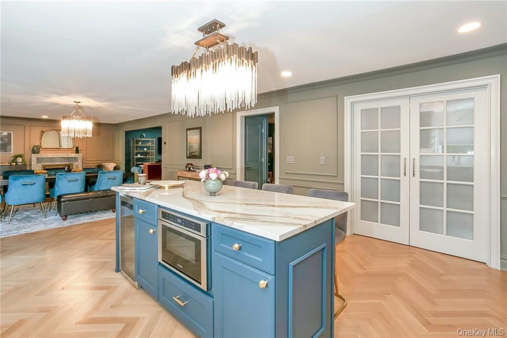 433 New Rochelle Road Bronxville, NY 10708 - Photo 12 of 41 a kitchen with a stove and a wooden floors