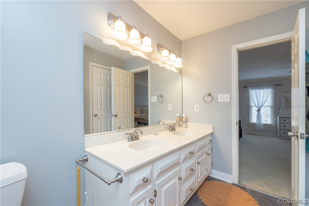 15205 Powell Grove Road Midlothian, VA 23112 - Photo 36 of 47 a bathroom with a sink double vanity and a mirror