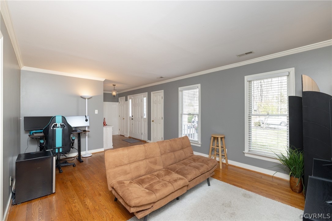 15205 Powell Grove Road Midlothian, VA 23112 - Photo 6 of 47 a living room with furniture flat screen tv and a large window