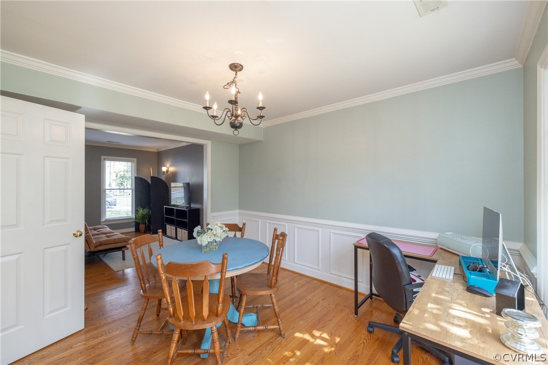 15205 Powell Grove Road Midlothian, VA 23112 - Photo 10 of 47 a view of a dining room with furniture and wooden floor