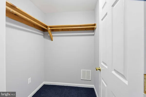 a view of room with racks on the wall