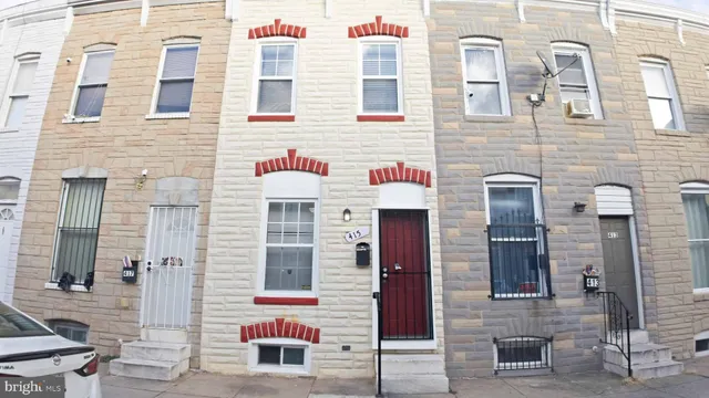 a front view of a building with many windows