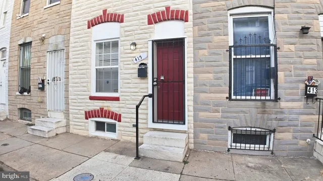 a front view of a building with many windows