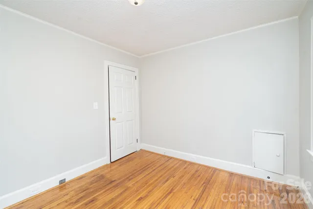 a kitchen with a refrigerator and a stove