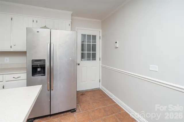 a view of a forest with trees in the background