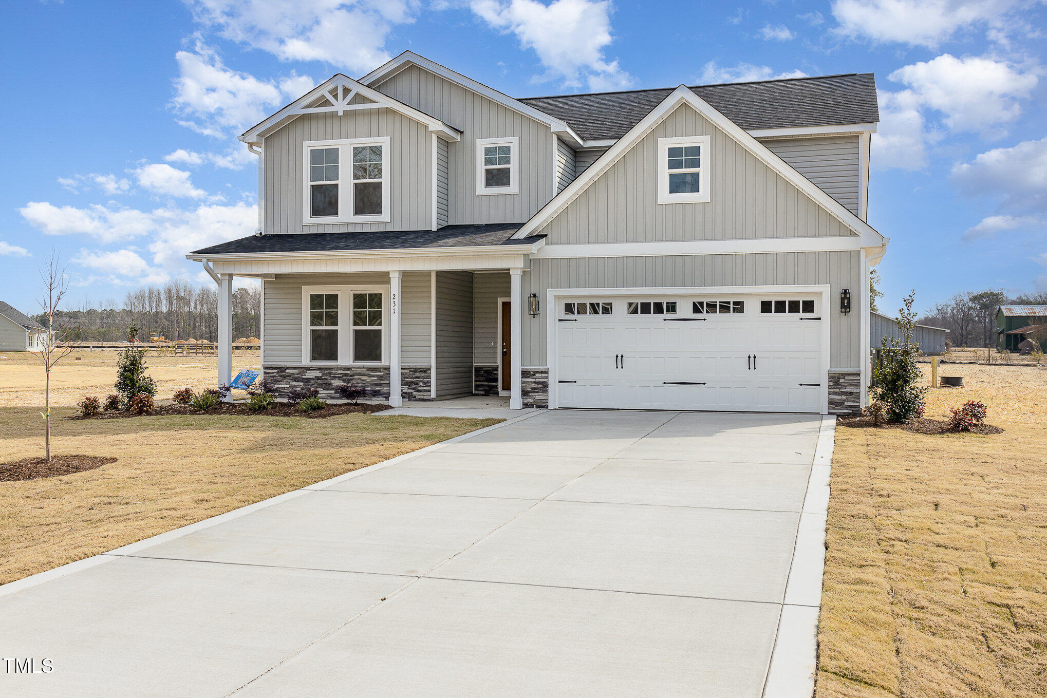 231 Trescott Street Smithfield, NC 27577 - Photo 2 of 28 a view of a white house with a outdoor space