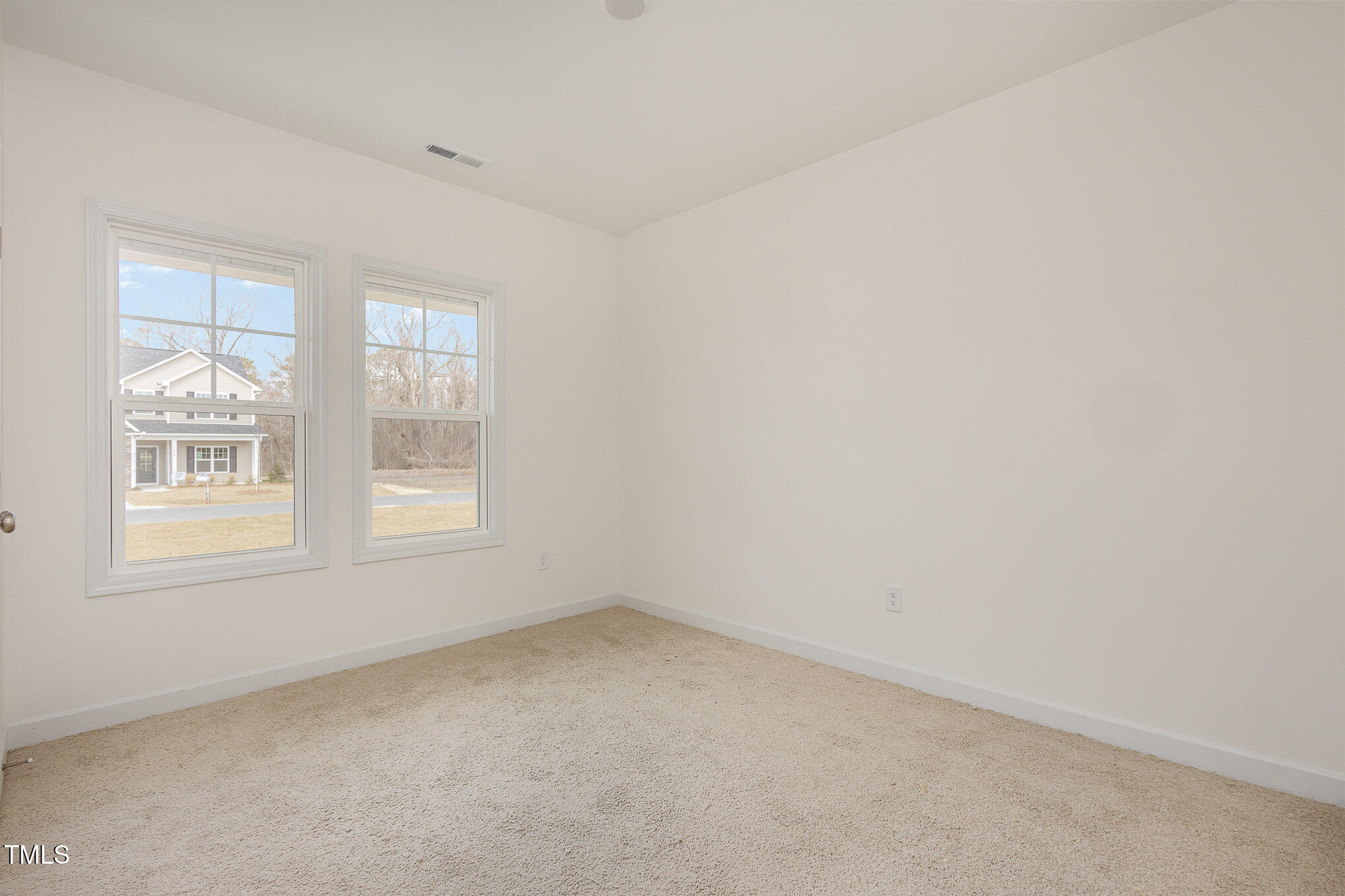231 Trescott Street Smithfield, NC 27577 - Photo 21 of 28 an empty room with a window
