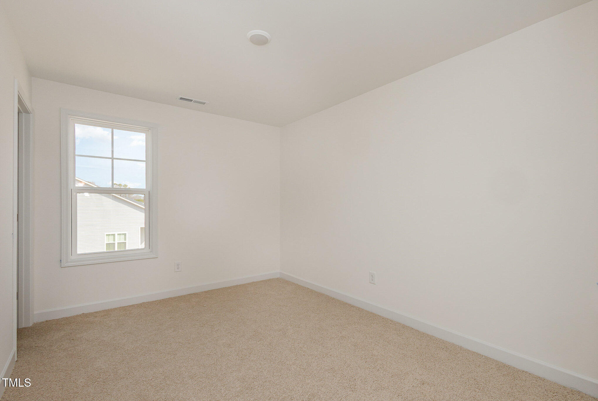 231 Trescott Street Smithfield, NC 27577 - Photo 22 of 28 an empty room with a window