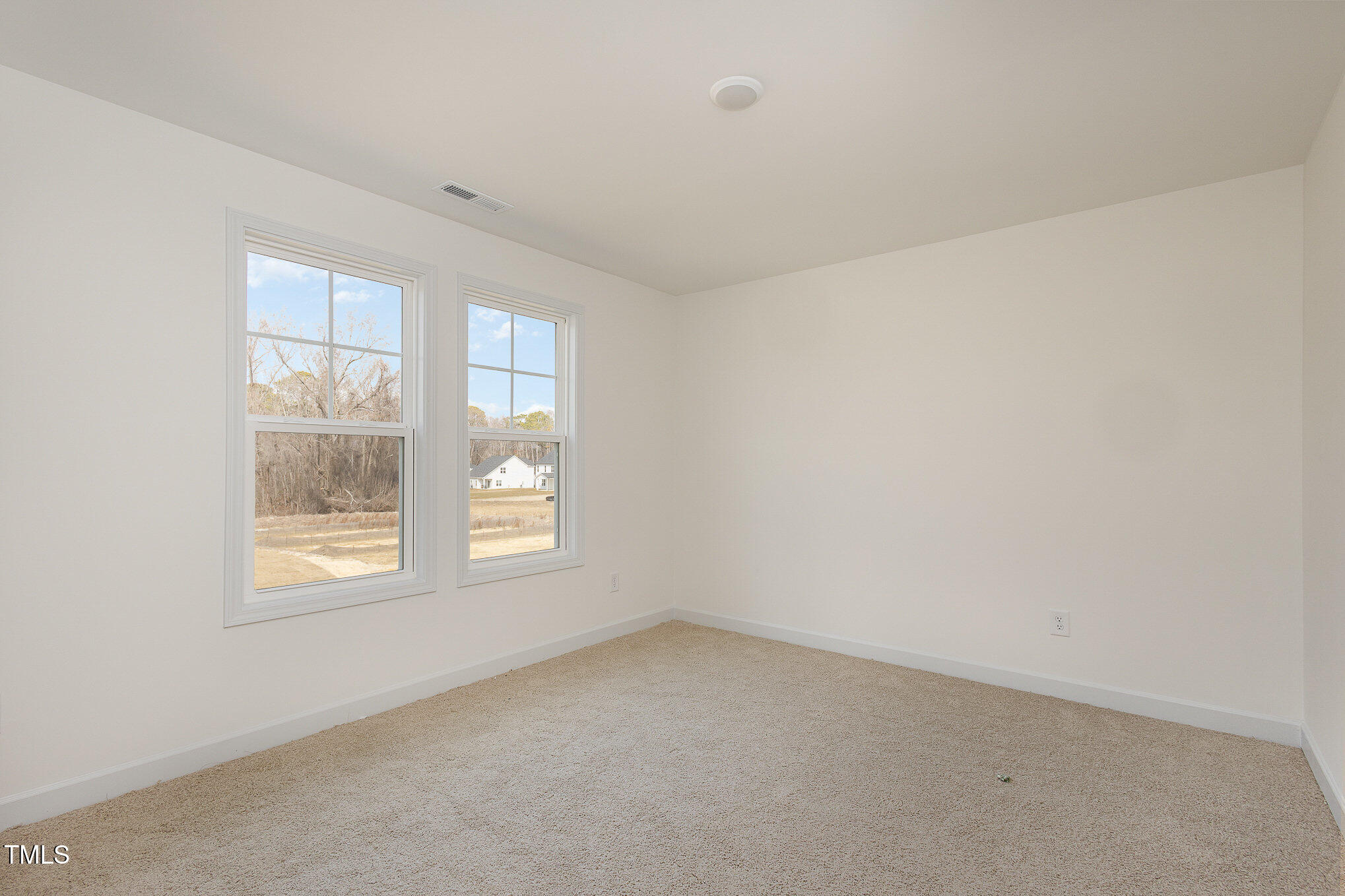 231 Trescott Street Smithfield, NC 27577 - Photo 24 of 28 an empty room with windows