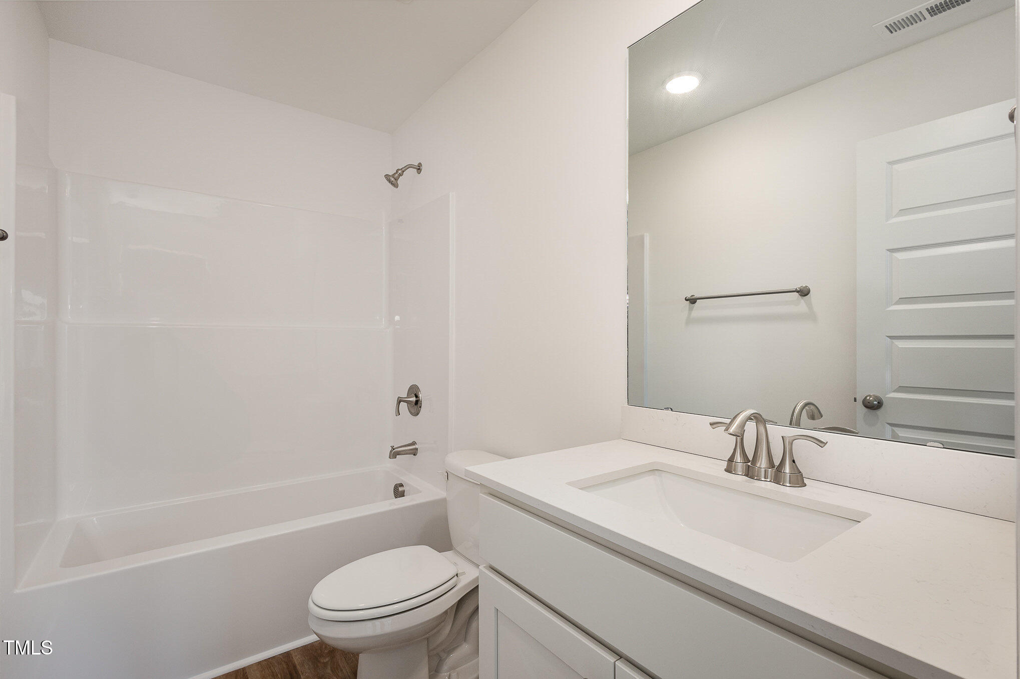 231 Trescott Street Smithfield, NC 27577 - Photo 26 of 28 a bathroom with a sink a toilet and shower