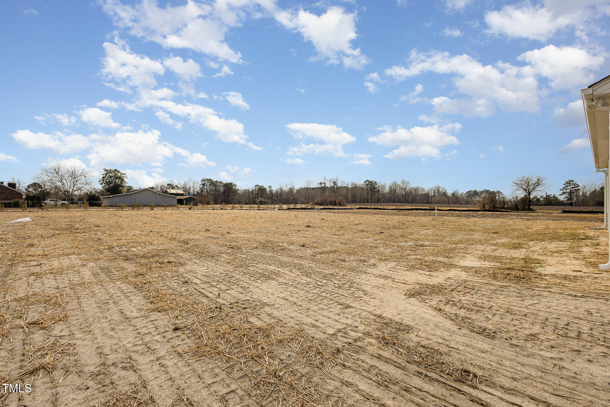 231 Trescott Street Smithfield, NC 27577 - Photo 28 of 28 a view of a lake with houses in the back