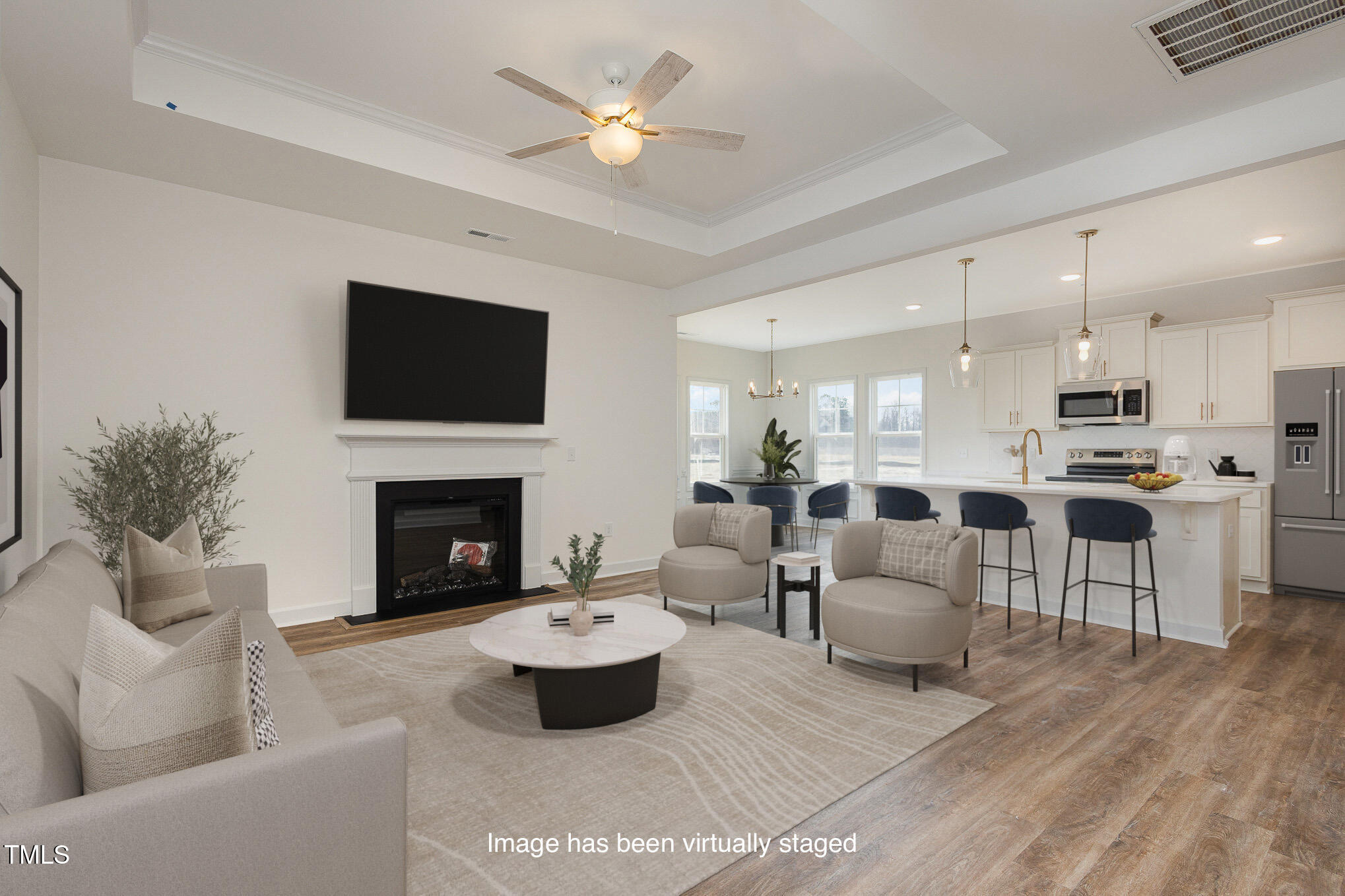231 Trescott Street Smithfield, NC 27577 - Photo 6 of 28 a living room with furniture a fireplace and a flat screen tv