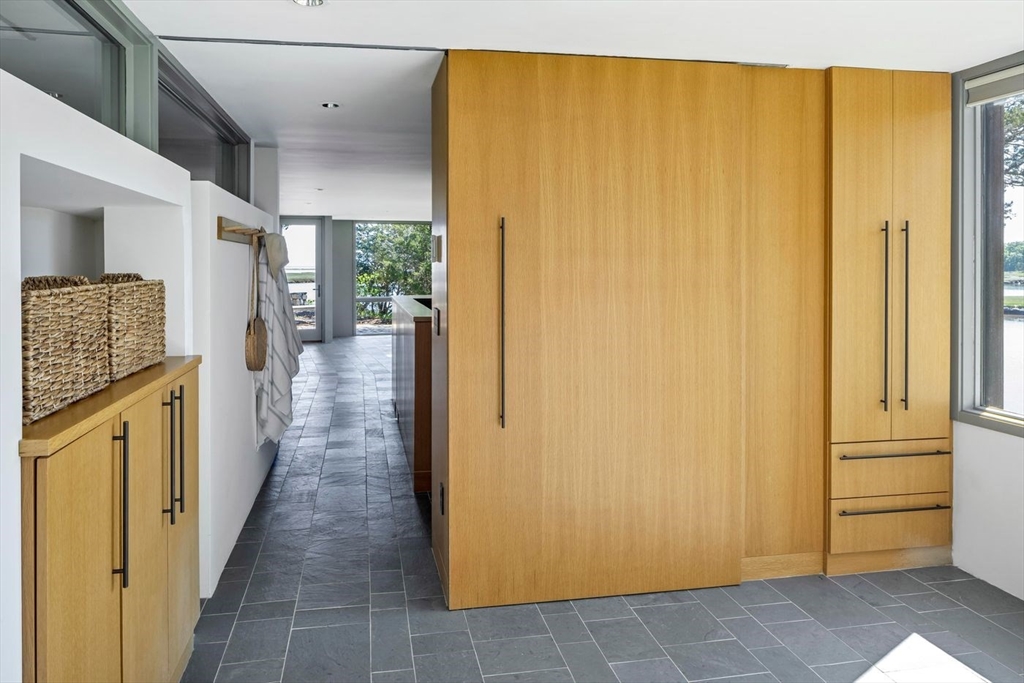 45 Lufkin Point Road Essex, MA 01929 - Photo 14 of 30 a view of a hallway with wooden cabinets