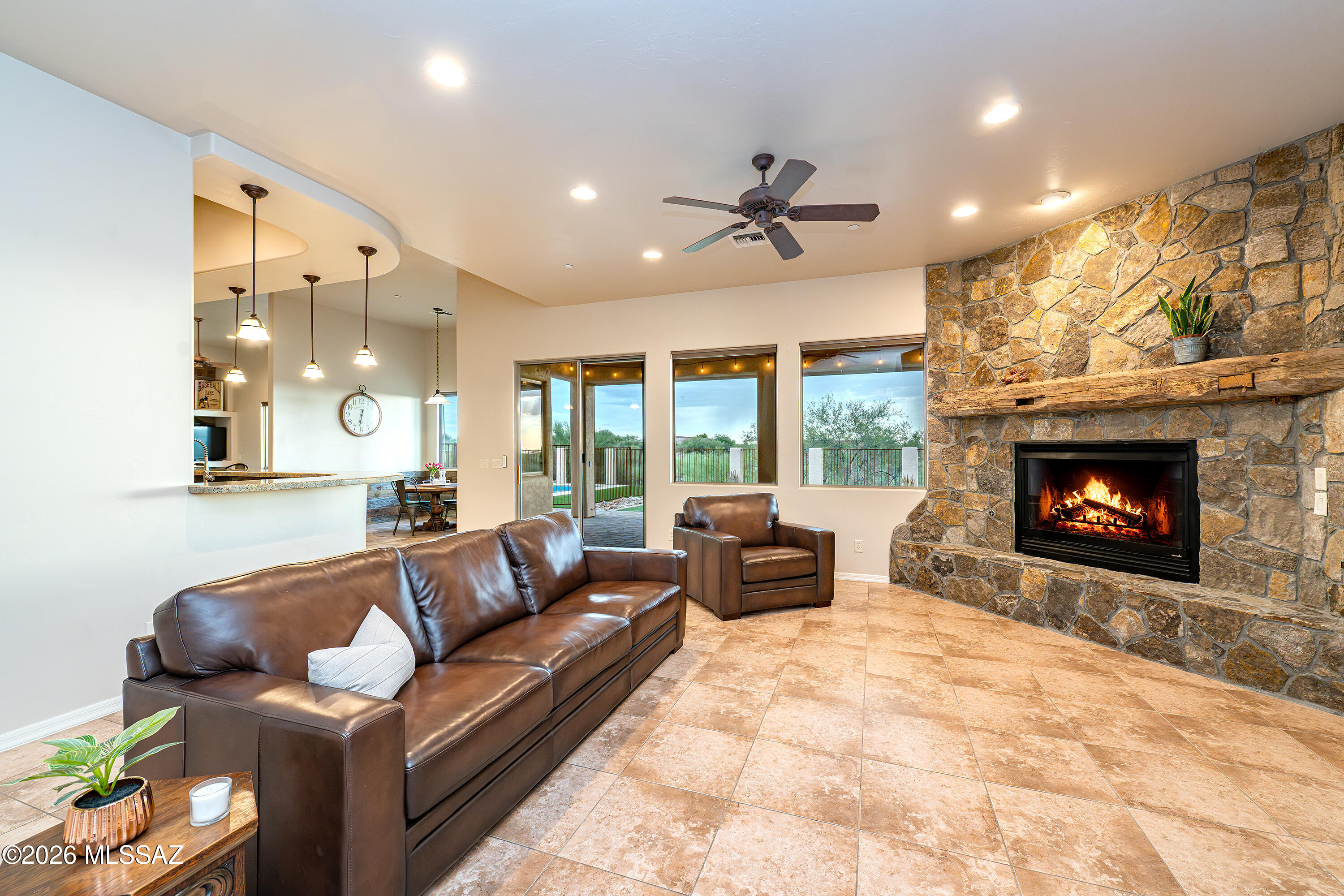 8550 South Picacho View Loop Vail, AZ 85641 - Photo 6 of 51 Open concept living spaces centered around real stone fireplaces.