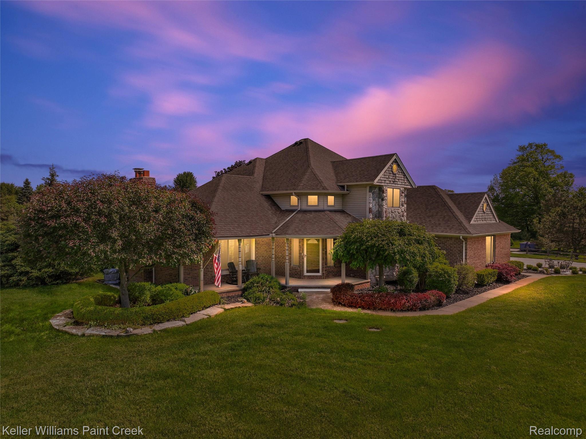 5813 36 Mile Road Romeo, MI 48065 - Photo 1 of 81 Spacious residence featuring a multi-gabled roofline, stone and brick facade, a covered front porch, established landscaping, and a manicured lawn