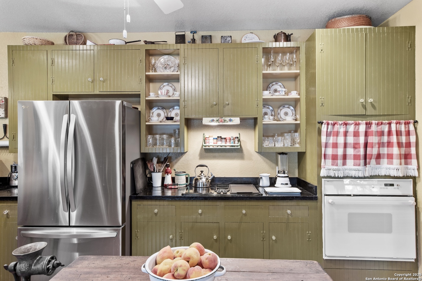 211 Riverside Drive West Llano, TX 78643 - Photo 18 of 74 a kitchen with a refrigerator and a stove