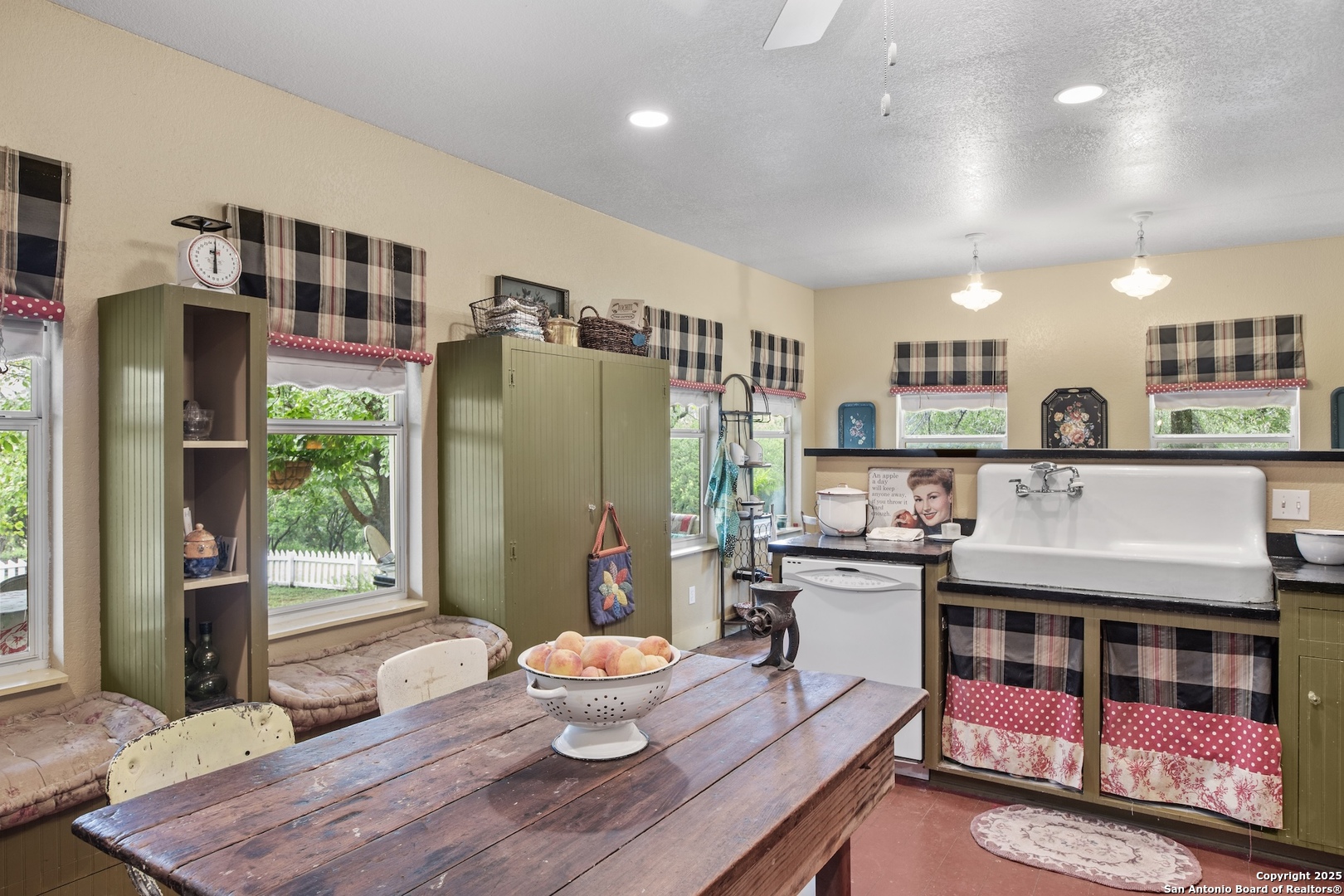 211 Riverside Drive West Llano, TX 78643 - Photo 19 of 74 a living room with stainless steel appliances furniture a rug and a kitchen view