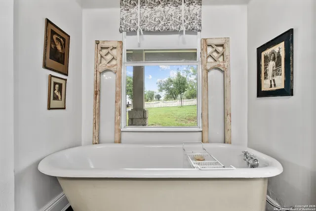 a bathroom with a double vanity sink a mirror and a shower